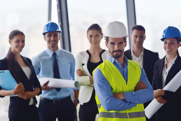 business people group on meeting and presentation  in bright modern office with construction engineer architect and worker looking building model and blueprint  plans